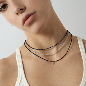 Choker made of black spinel with a cross pendant