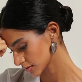 Silver heart earrings with a red insert