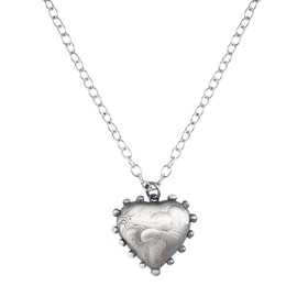 Pendant with a metal heart
