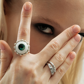 A ring with a green eye