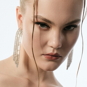Golden earrings with long crystal track pendants