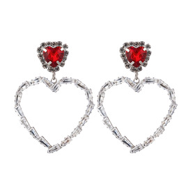 earrings in the form of hearts with red crystals