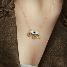 Gold-tone necklace with three coins and an eye