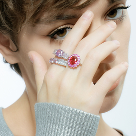 Silver ring with three large pink crystals