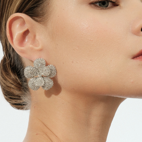 Silver flower-shaped earrings with a scattering of crystals