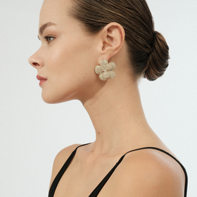Golden flower-shaped earrings with a scattering of crystals