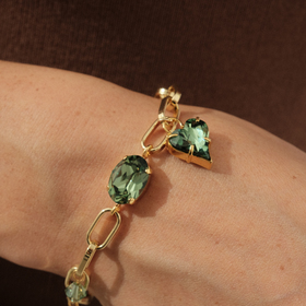 Gold-plated chain link bracelet with green crystals