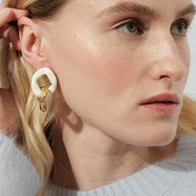Gold link earrings with white enamel