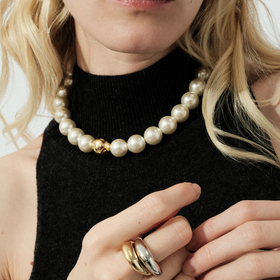 Pearl bead necklace with an accent golden bead