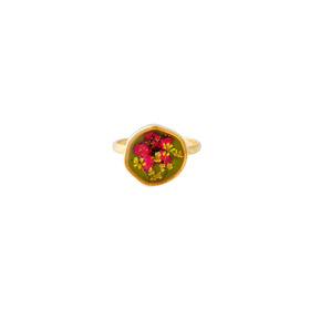 A small golden green round ring with a red flower