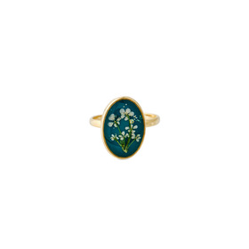 Golden oval blue ring with white flowers