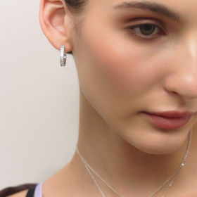 Silver hoop earrings with crystals tracks