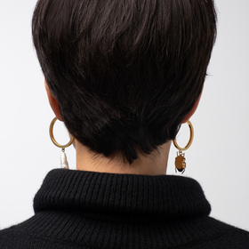 gold-plated silver asymmetric earrings with a pearl and a bug