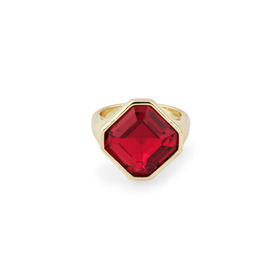 Golden ring with red crystal
