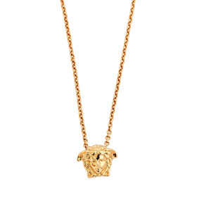 Gold pendant on a chain with the Versace logo