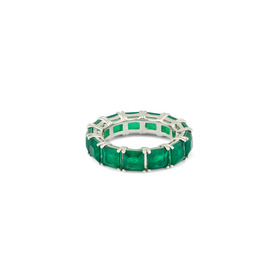 A silver ring with a path of green crystals