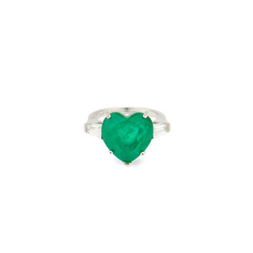 A silver ring with a large green crystal heart