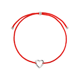 A heart bracelet made of silver on a red thread