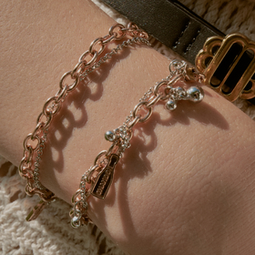 Special collection of Chandon x Poison Drop. Chain bracelet with pink gold pendants