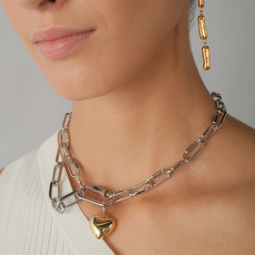 Silver chain necklace with a golden heart