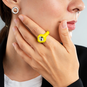 yellow polymer clay ring with a large transparent rhinestone