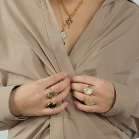 Gold-plated ring with a large white onyx