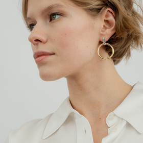 silver earrings with a gold-plated halo