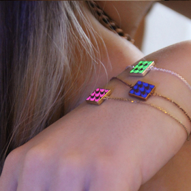 gold-plated double-sided silver bracelet with a neon enamel houndstooth pattern