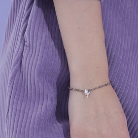 silver haze bracelet with a silver hand pendant