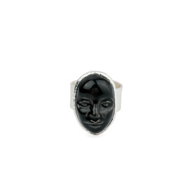 Small silver-plated ring with a black porcelain cabochon in the shape of a face