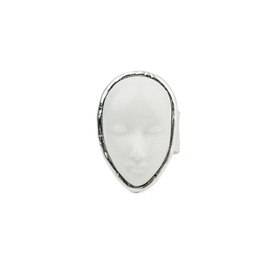 large silver plated ring with a face-shaped white porcelain cabochon