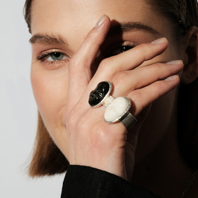 Small silver-plated ring with a black porcelain cabochon in the shape of a face