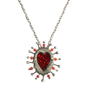 silver plated pendant with heart and spikes