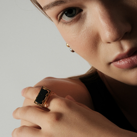 Gold-tone ring with black insert