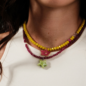 yellow bead necklace with a pink flower