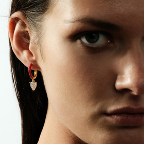 gold-tone enamel earrings with an oval cut pendant