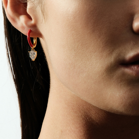 gold-tone enamel earrings with an oval cut pendant
