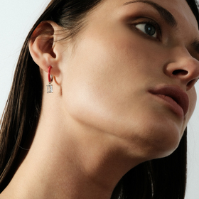 enamel earrings with a baguette cut pendant