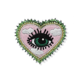 heart brooch with an eye on a pink background with clouds