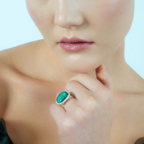 The ring with dichroic glass is bright green
