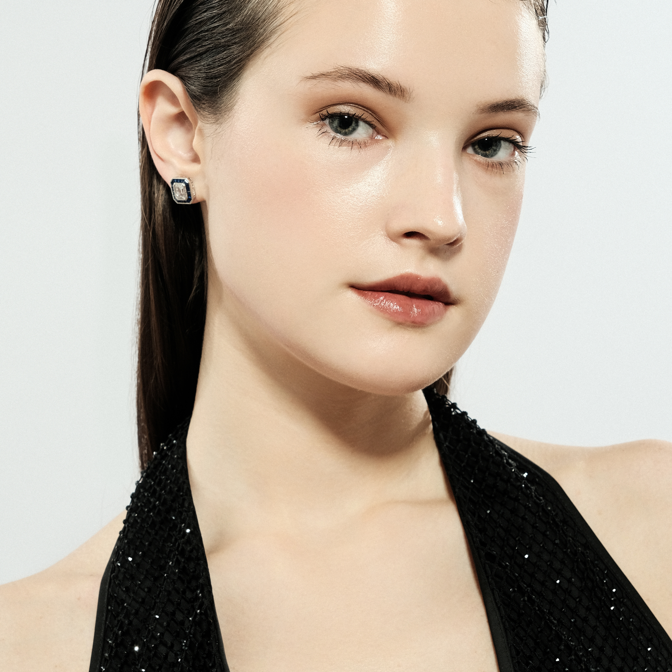 Silver stud earrings with a large white crystal buy at Poison
